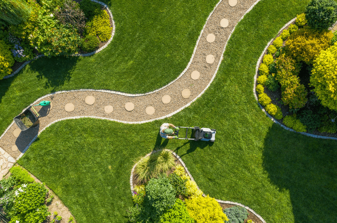 landscaped lawn aerial view by man completing lawn services